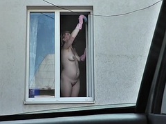 Neighbor taxi driver watches MILF neighbor washing apartment window naked. Naked in public