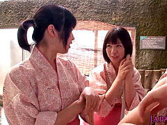 group of tiny Japanese honies sharing trouser snake in onsen