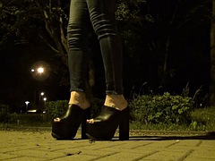 Crossdresser in very high platform shoes