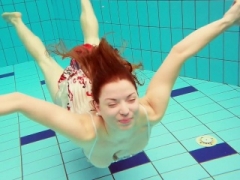 Hot Polish redhead swimming in the pool