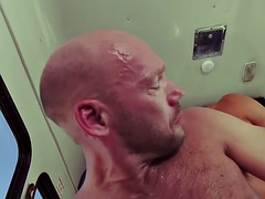 Bald stallion is fucked and fisted in his anal hole in a car duo