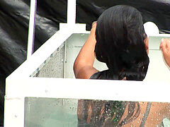 black-haired Dunk Tank Wetlook in dark-hued dress