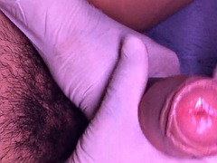 Uncut cock close up and cum in latex gloves in slow motion at the end