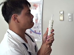 Real Asian twink gets an enema in doctors office after anal swallowing