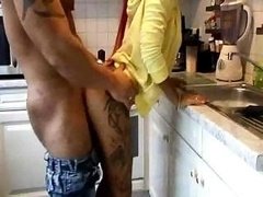 Fine sexual act in the kitchen room from two aroused lovers