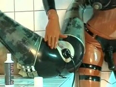 Submissive lesbian slut anal inflatation in latex black bodysuit