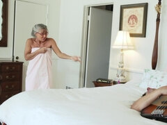 An mature dame is getting her loose mature pussy fucked on the bed