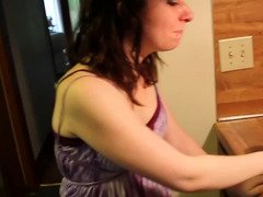 A kitten shows off her boobs and additionally then she licks some hard purple pole