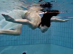 Brunette teen Andrea in the pool