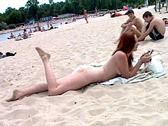 insatiable young nudists play with each other in sand