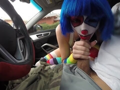 Clown girl sucks cock in a car like a real circus freak