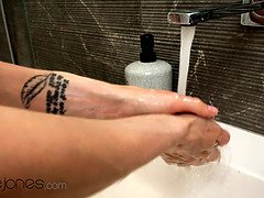 Nancy A's bald pussy gets soaked in steamy shower solo play