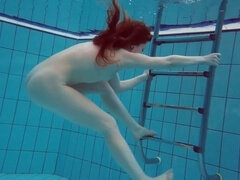 Talented Alisha Rage flaunts her skills underwater in a seductive swimming session