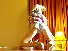 Gina Gerson performs a seductive striptease ending in a fiery anal pounding on ULTRAFILMS