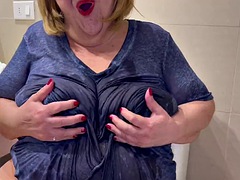 Hot granny playing with wet t-shirts with the huge tits that this fat old woman has