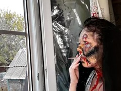 Wife smokes a cigarette makeup zombie