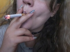 Closeup, she smokes, beutifull girl