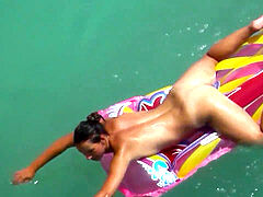 cool bare cougars Sunbathing Nude in the water voyeur spy cam