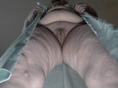 Curvy mature granny proudly reveals her bushy upskirt view from behind.