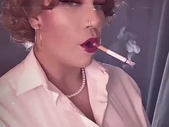 Mrs. Dangle smokes 2 very long cigarettes.