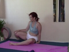 Redhead MILF's yoga wheel and evening stretch lead to steamy behind-the-scenes and nude content