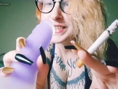 Blonde femdom plays with dildo and smokes a cigarette in homemade masturbation video