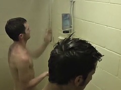 Athletic jocks jerk off their hard cocks in a hot shower