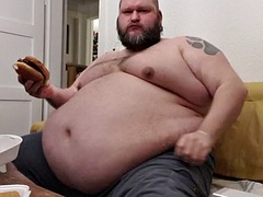 Superchubby SOC - fat guy eating a big burger and onion rings