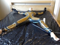 Latex Danielle is attached to the bed and also masturbated with the massage vibrator. Entire video