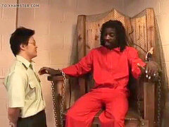 Asian dude eletrocutes prisoner, makes him plow ebony guard