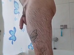 Hairy man showers and masturbates