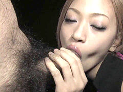 Japanese beauty deep-throats a gigantic rock-hard dong in the dark