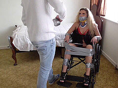 a superslut is taped to her wheelchair for being argumentative