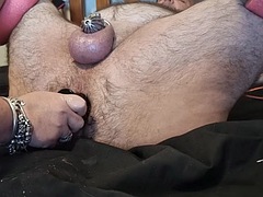 Ms Chonk stretches M. Chonks ass with butt plugs while he wears a cock cage and is tied up
