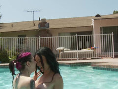 Britanny Lynn and Joanna Angel tease each other in the pool