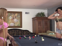 Kat Dior fucks Missy Martinez with a thick purple dildo on a pool table