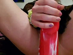 KrystallCox uses a huge red dildo in her little ass