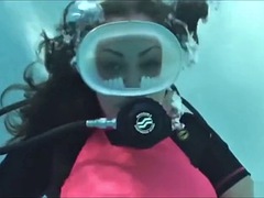 Striptease underwater with scuba gear