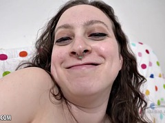 Delphine rubs and fingers her hairy clitoris
