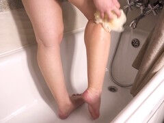 Seductive amateur showers and teases with her irresistible calves