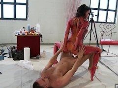 A woman gets covered with body paint and then she is fucked