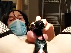 Hot brunette transwoman gets double anal fucked while locked in chastity belt