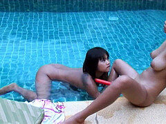 two gorgeous Thai teenagers dearest a poolside double dildo fun