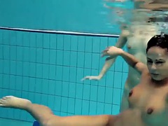 Nina Markova and Zlata Oduvanchik swimming naked in the pool