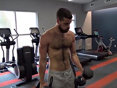 Hairy young stud strokes big cock solo after hot workout session