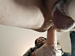 Slaves ass takes the harness and his cock is in a chastity belt. Femdom