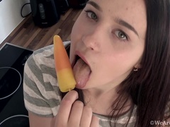 Julia Moore enjoys a frozen treat while stripping