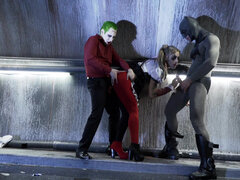 Superhero Kleio Valentien sandwiched between Joker and Batman