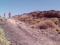 Couple Is Hiking Naked Near the Coast