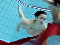 two underwater girls loving eachother